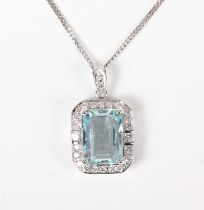 A white gold, aquamarine and diamond cluster pendant, claw set with the cut cornered rectangular