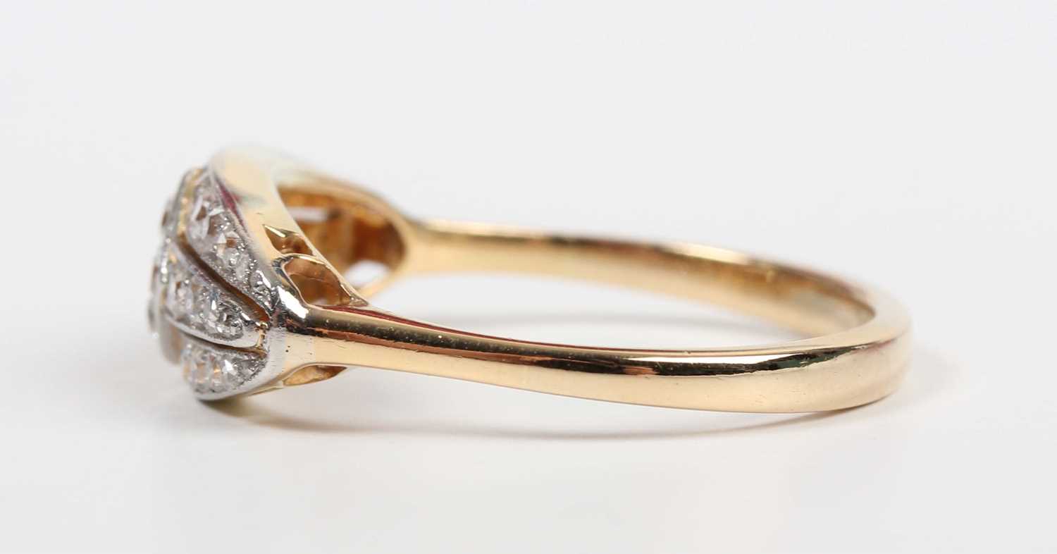 A gold and diamond ring in an oval panel shaped design, mounted with circular cut diamonds, - Image 3 of 5