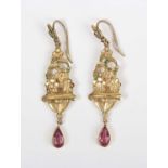 A pair of late Victorian gold pendant earrings, each in a floral design with a pear shaped pink