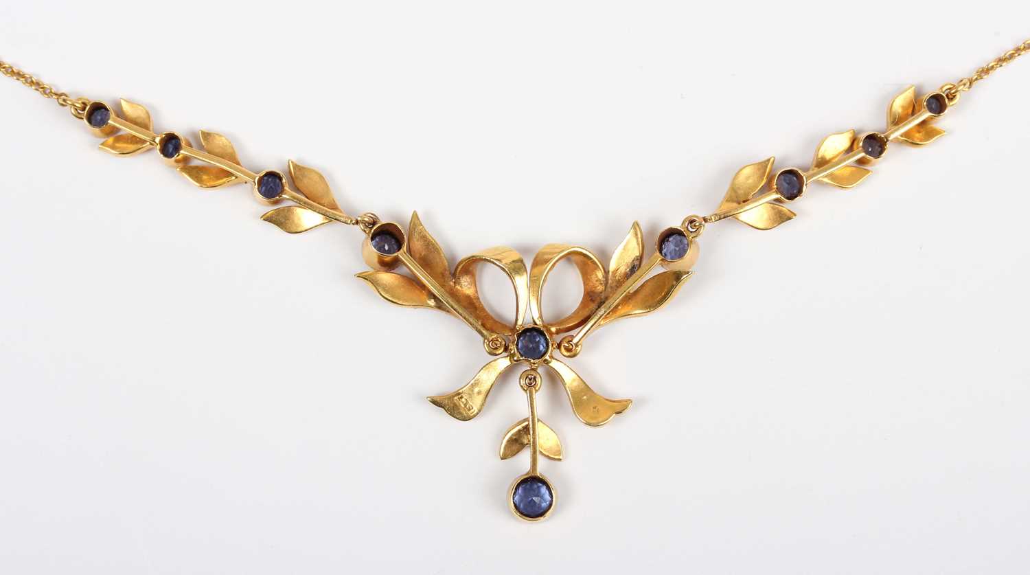 An Edwardian gold, sapphire and seed pearl necklace, the front designed as a tied bow with foliate - Image 3 of 3