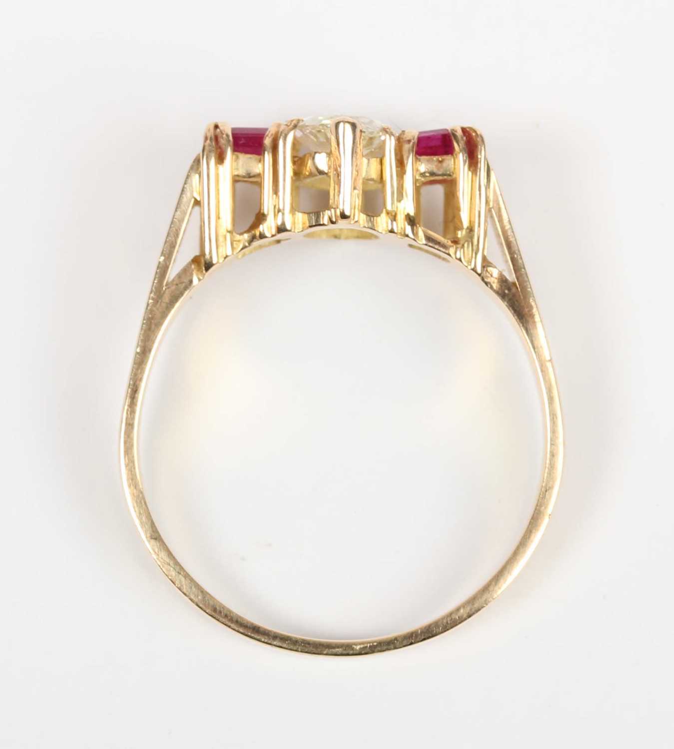 A gold, diamond and ruby ring, claw set with the marquise shaped diamond between two square cut - Image 4 of 5