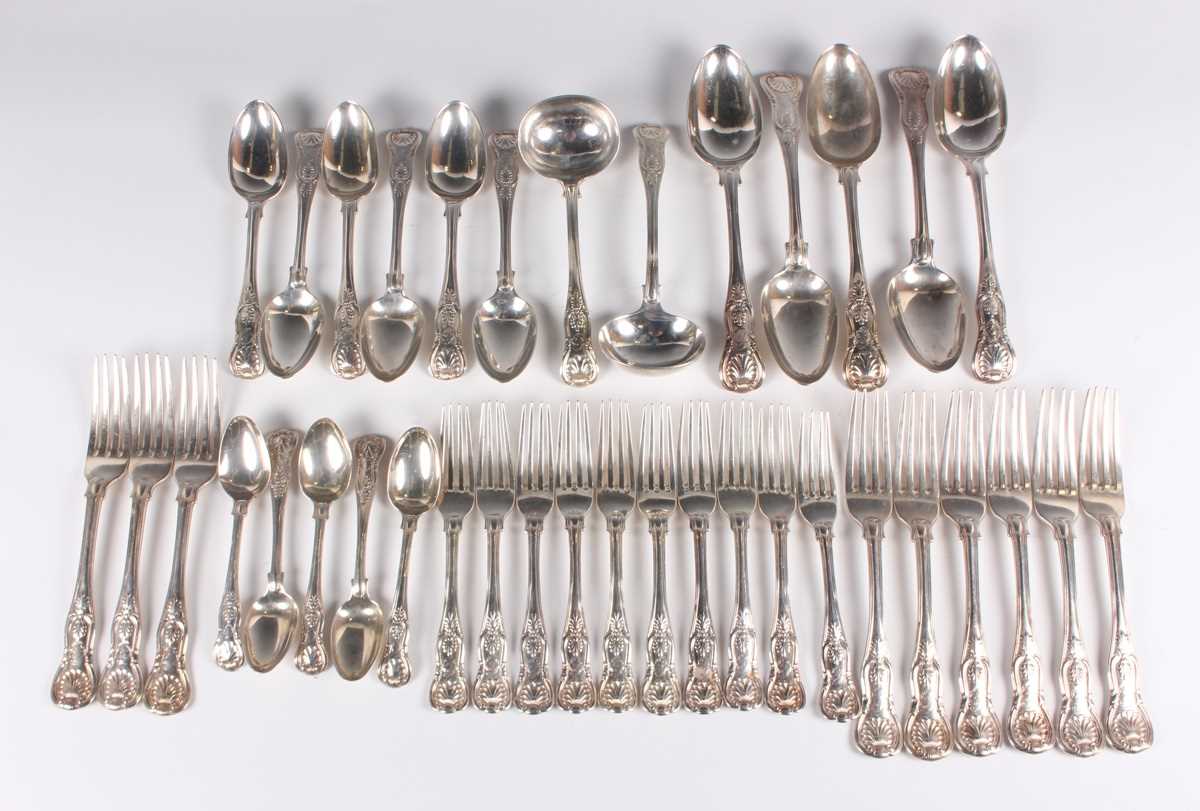 A Victorian canteen of silver King's pattern cutlery, comprising nine table forks, five tablespoons,
