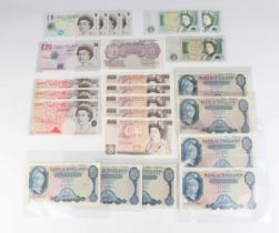 A large collection of British banknotes, including four consecutive Elizabeth II Bank of England