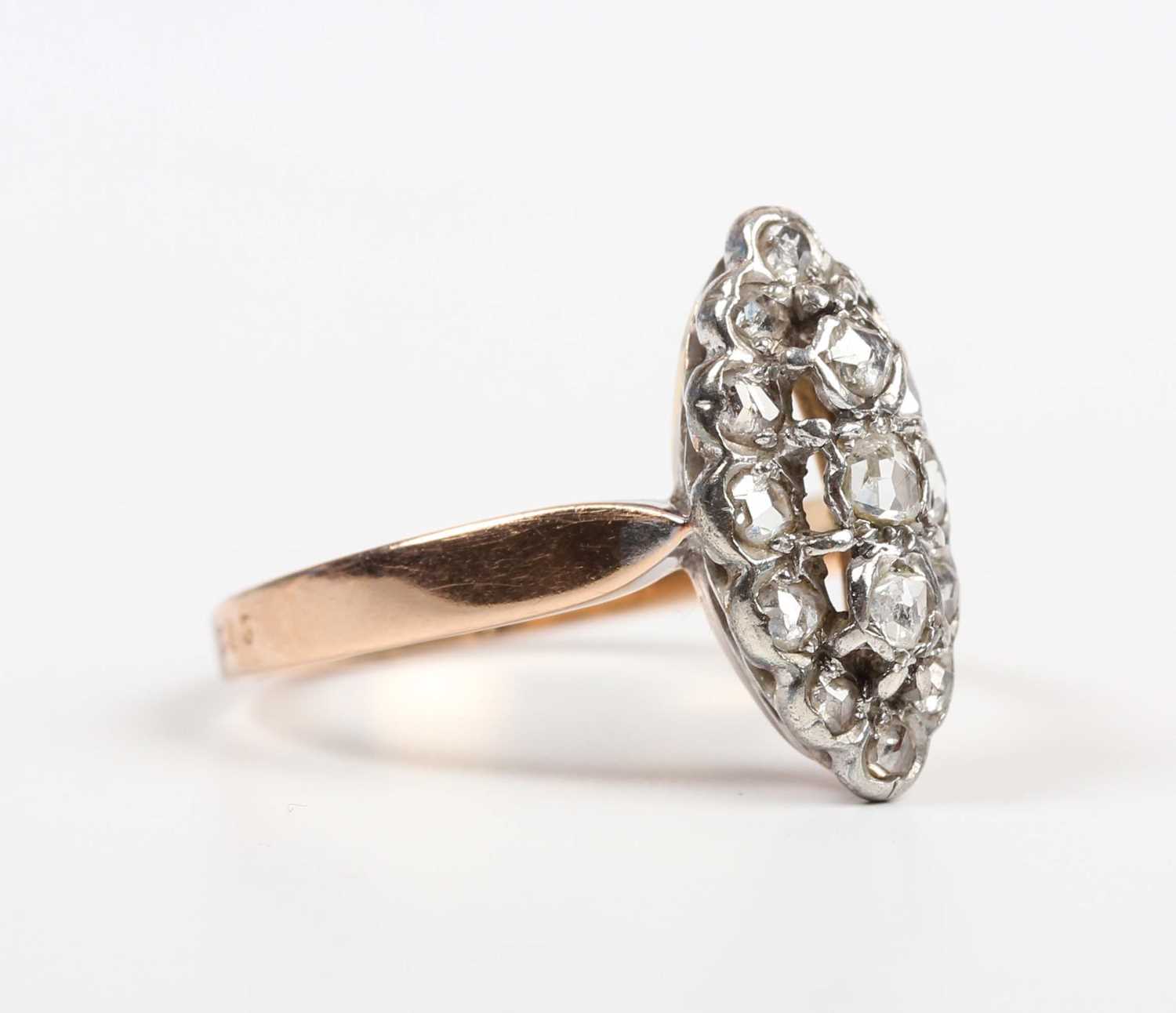 A French gold and diamond marquise shaped cluster ring, mounted with rose cut diamonds, weight 3.4g,