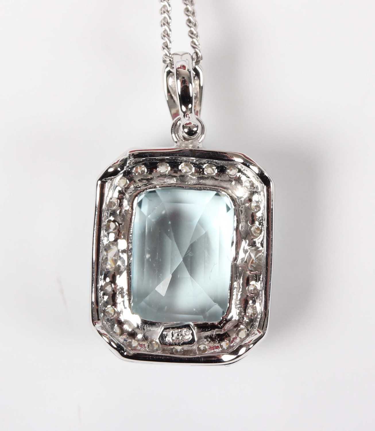 A white gold, aquamarine and diamond cluster pendant, claw set with the cut cornered rectangular - Image 3 of 3