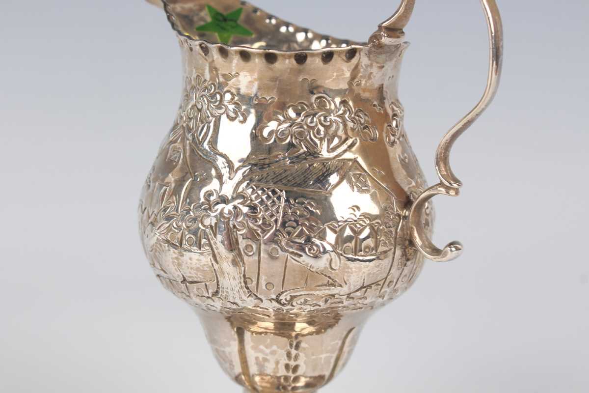 A George III silver oval cream jug, engraved with festoon tassel decoration, London 1801, height 9. - Image 5 of 6