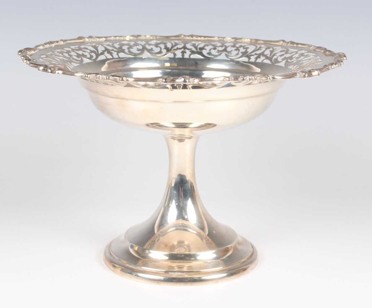 A George V silver tazza, the circular top with pierced scroll decoration within a cast scroll rim,