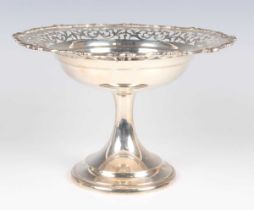 A George V silver tazza, the circular top with pierced scroll decoration within a cast scroll rim,