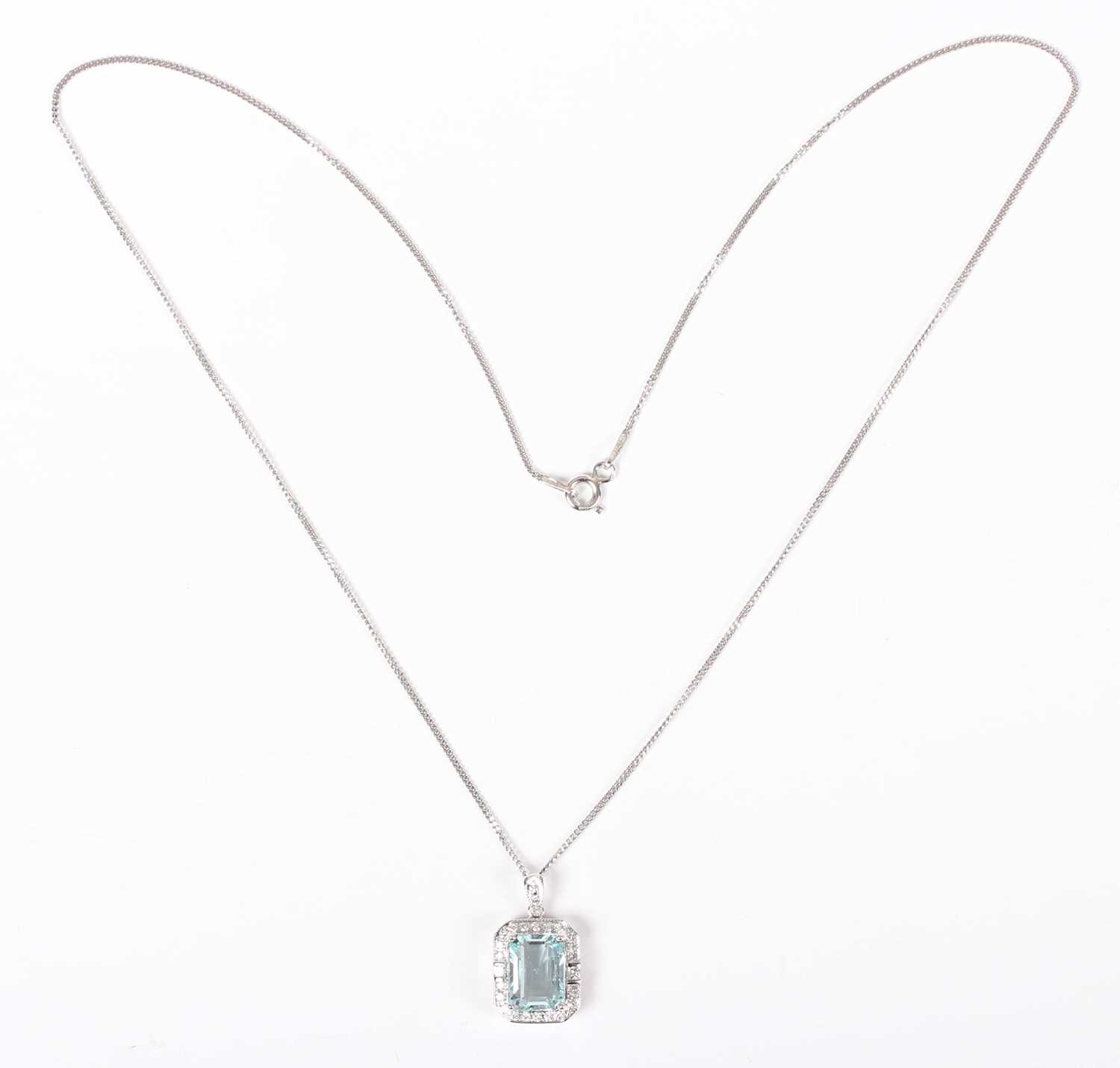 A white gold, aquamarine and diamond cluster pendant, claw set with the cut cornered rectangular - Image 2 of 3