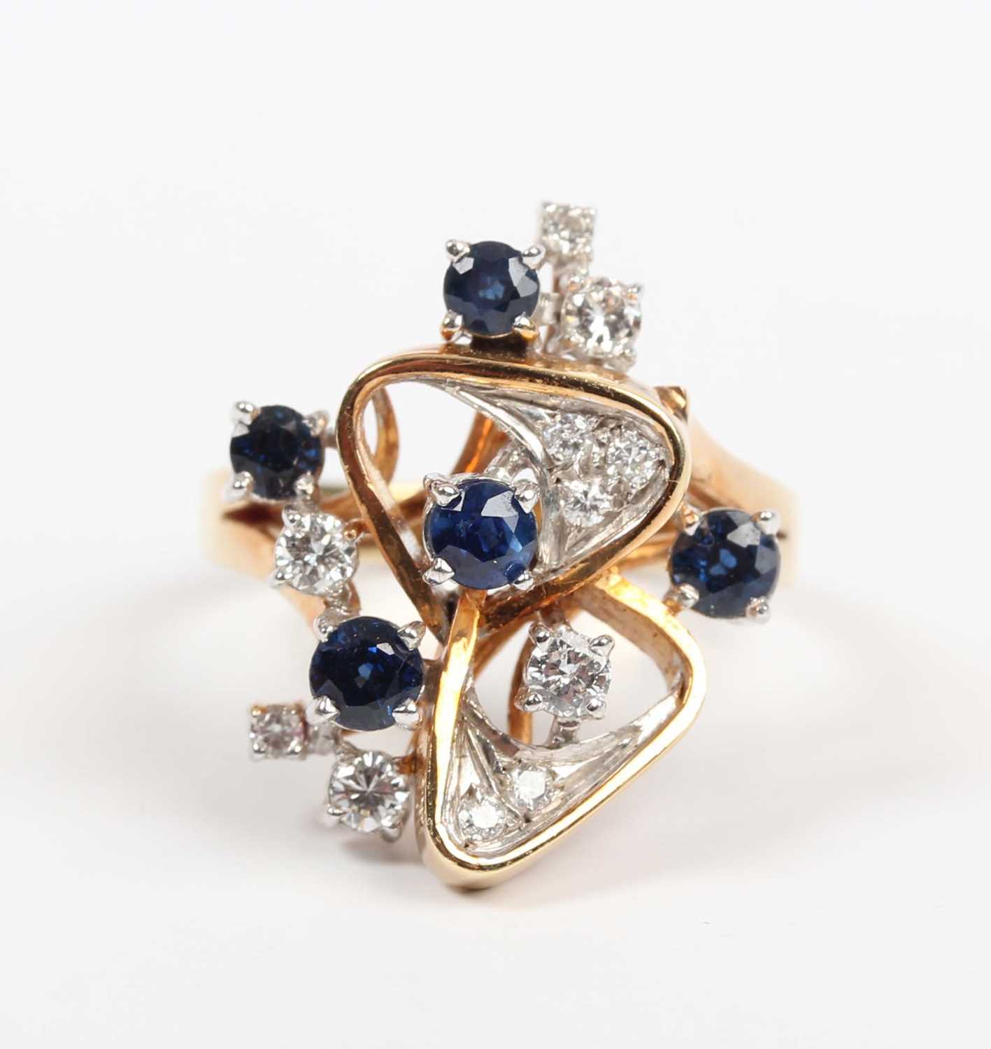 A gold, sapphire and diamond ring in an abstract design, claw set with five circular cut - Image 2 of 5