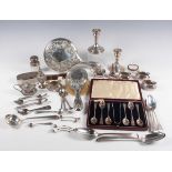 A late Victorian silver three-piece condiment set of cushion form, embossed with floral and