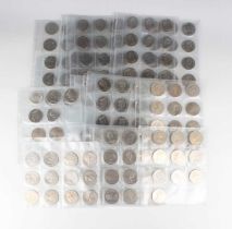 A large collection of Elizabeth II crown-size commemorative coins.