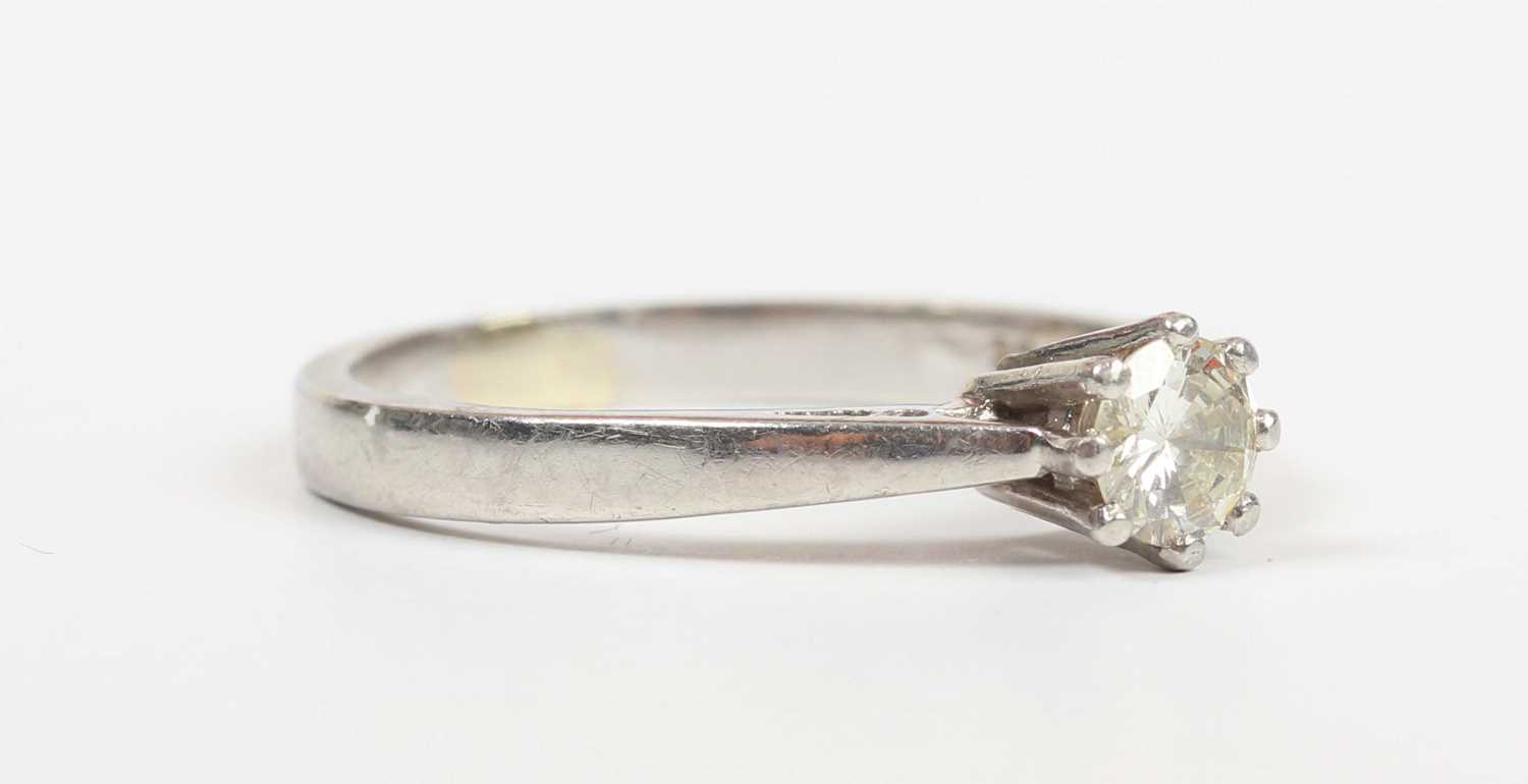 A platinum and diamond single stone ring, claw set with a circular cut diamond, detailed ‘.33ct’