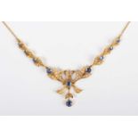 An Edwardian gold, sapphire and seed pearl necklace, the front designed as a tied bow with foliate