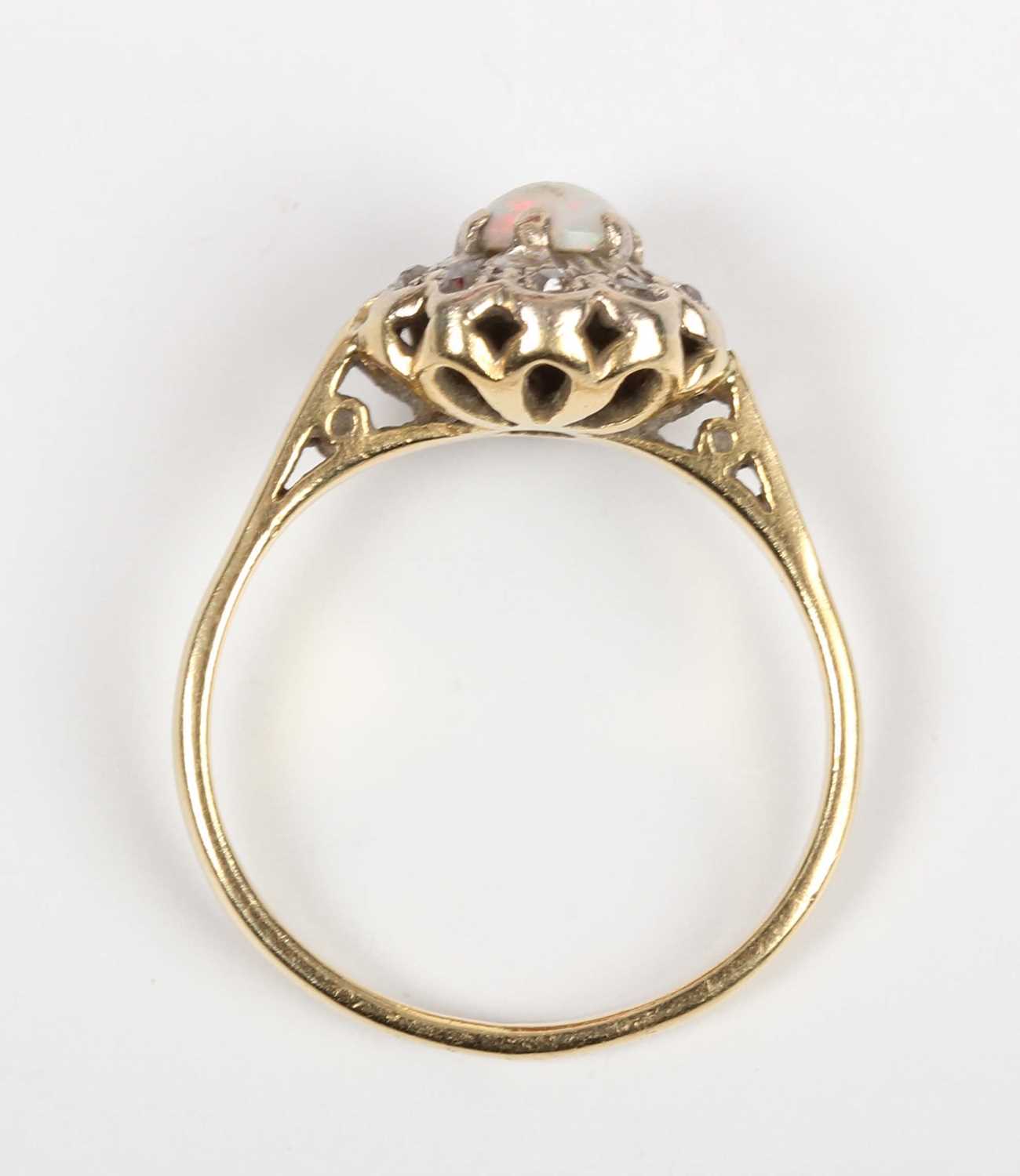 A gold, opal and diamond cluster ring, claw set with the circular opal within a diamond set - Image 4 of 5
