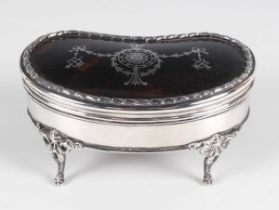 A George V silver and tortoiseshell kidney shaped trinket box with piqué inlaid decoration, on