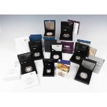 A group of nine Elizabeth II Royal Mint silver proof commemorative coins, including two First