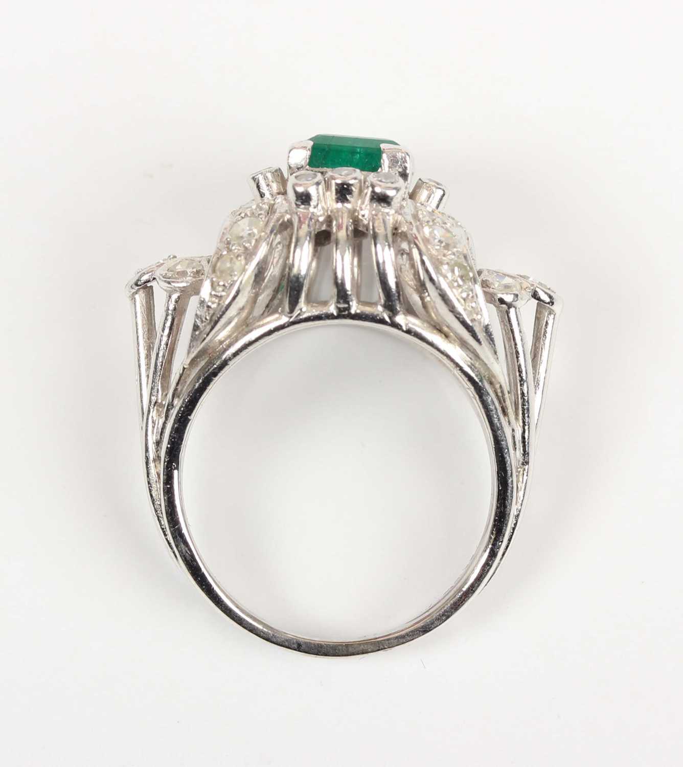 An emerald and diamond cocktail ring, claw set with the rectangular step cut emerald between - Image 4 of 5