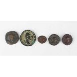 A group of five Roman coins, including an Antoninius Pius sestertius, reverse with Salus standing