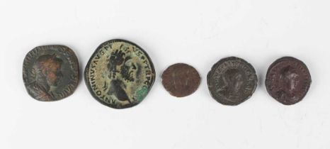 A group of five Roman coins, including an Antoninius Pius sestertius, reverse with Salus standing