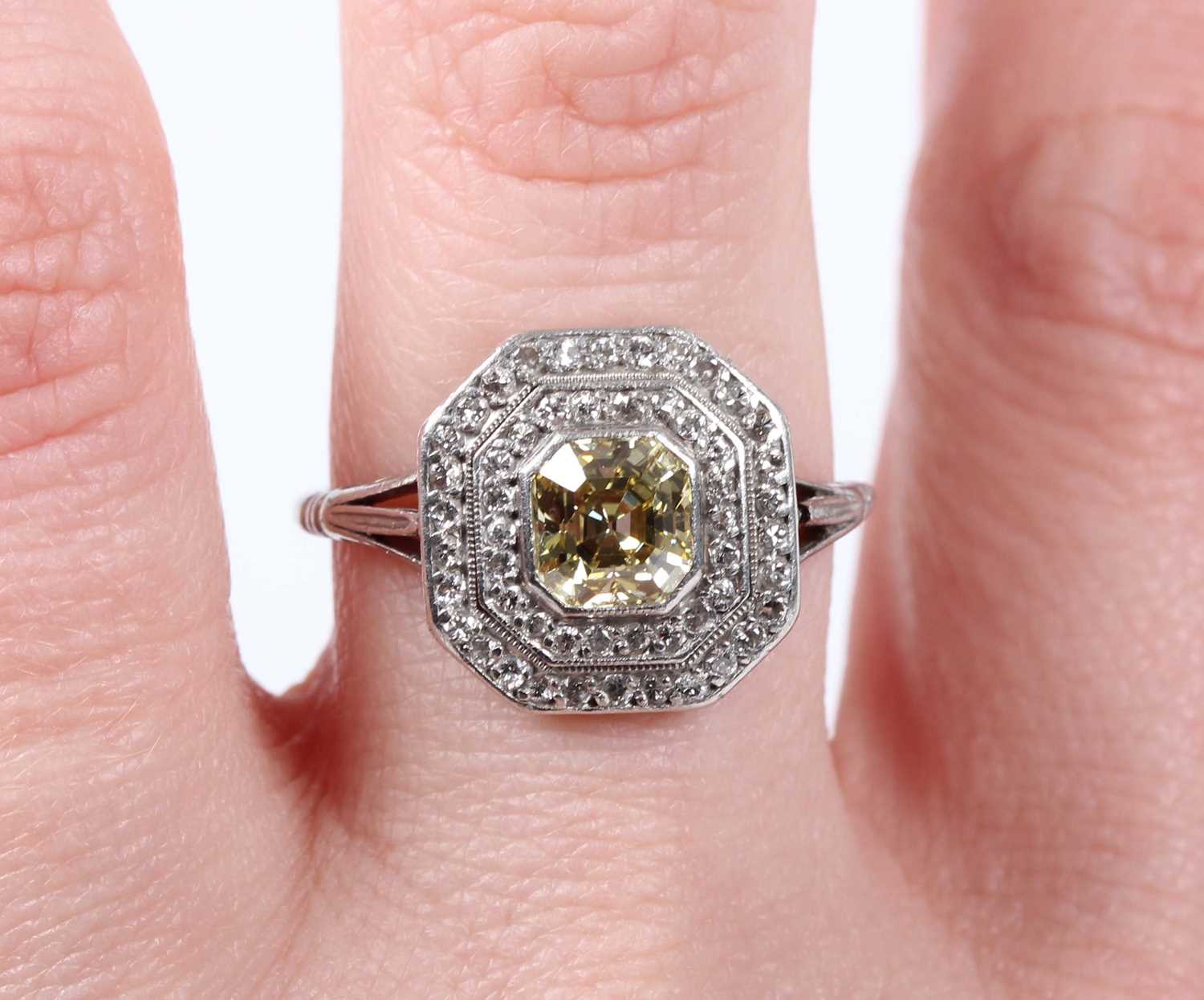 A platinum, fancy intense yellow diamond and diamond ring, mounted with the asscher cut fancy - Image 5 of 6