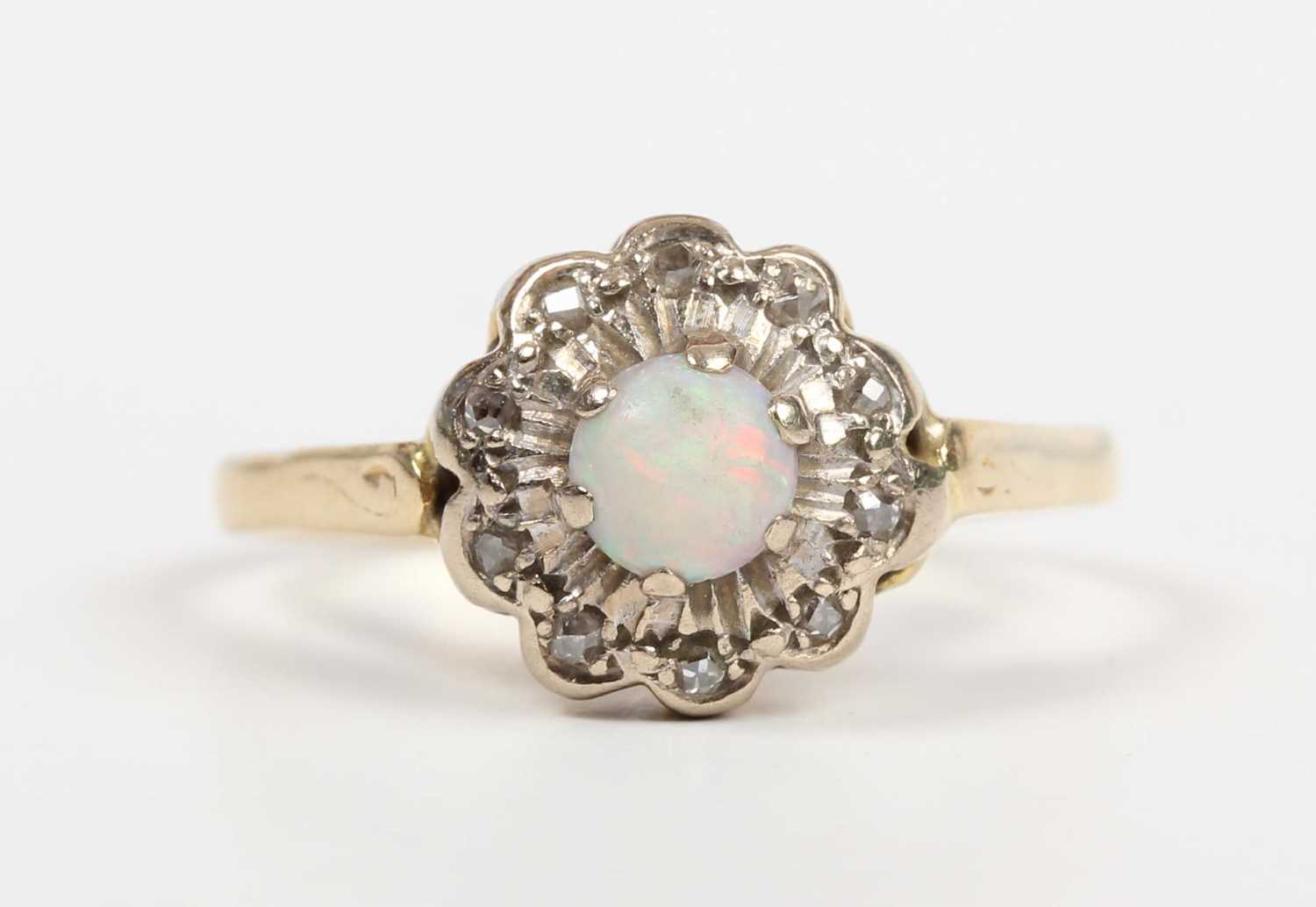 A gold, opal and diamond cluster ring, claw set with the circular opal within a diamond set - Image 2 of 5