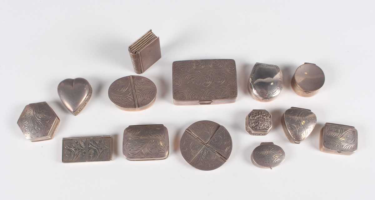 A group of fourteen silver pill and snuff boxes, including a circular pillbox with four hinged