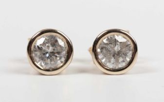 A pair of gold and diamond single stone earstuds, each collet set with a circular cut diamond,