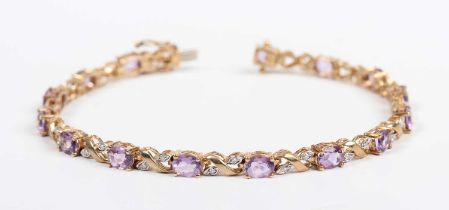 A gold, amethyst and diamond bracelet, claw set with a row of oval cut amethysts alternating with