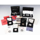 A collection of Elizabeth II Royal Mint silver proof coins and commemoratives, including a Britannia