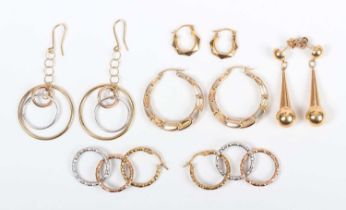 Four pairs of 9ct gold earrings in a variety of designs, and another pair of gold earrings in a