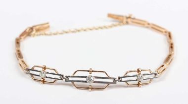 A gold, platinum and diamond bracelet, circa 1920, the front in an openwork triple panel shaped link