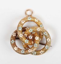 A gold, diamond and enamelled pendant brooch in an entwined trefoil design, claw set with a