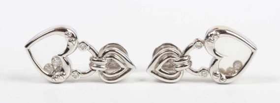 A pair of 18ct white gold and diamond pendant earrings, each designed as a stylised heart shaped