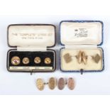 A pair of 9ct gold oval cufflinks with feathered scroll engraved decoration, Chester 1924,