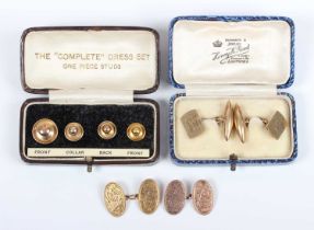 A pair of 9ct gold oval cufflinks with feathered scroll engraved decoration, Chester 1924,