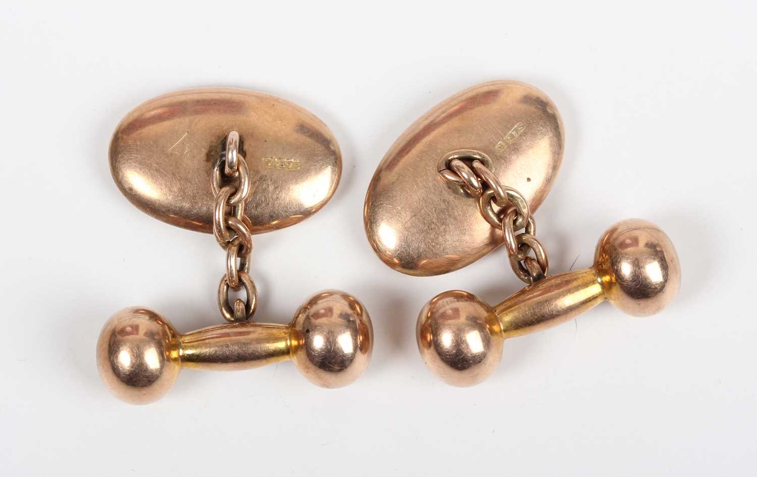 A pair of 9ct gold cufflinks, each oval front with engraved decoration, with dumbbell shaped - Image 3 of 3