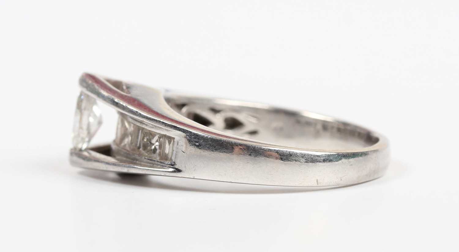 A platinum and diamond ring, mounted with the principal marquise shaped diamond in a raised - Image 3 of 5