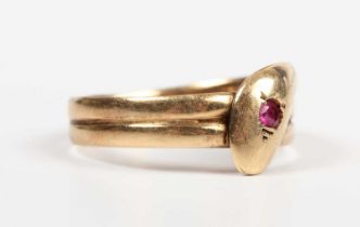 An 18ct gold ring designed as a coiled snake, the head mounted with a red gemstone, Chester 1916,