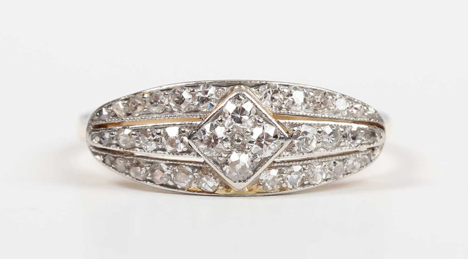 A gold and diamond ring in an oval panel shaped design, mounted with circular cut diamonds, - Image 2 of 5