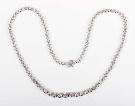 An 18ct white gold and diamond collar necklace, claw set with a row of graduated circular cut