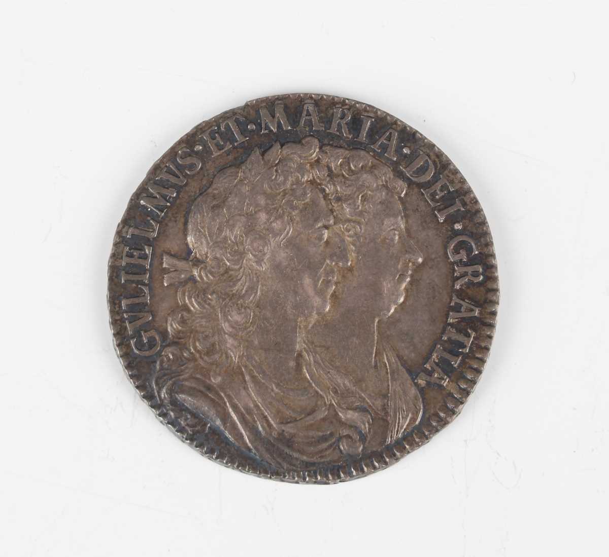 A William and Mary half-crown 1690, first busts, second crowned shield, edge detailed 'Tertio' (