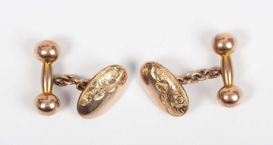 A pair of 9ct gold cufflinks, each oval front with engraved decoration, with dumbbell shaped