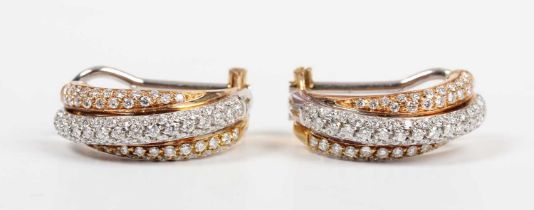 A pair of Leo Pizzo two colour gold and diamond half hoop earrings in a twist design, pavé set
