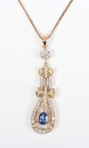 A gold, sapphire and diamond pendant, claw set with the oval cut sapphire within an openwork pear