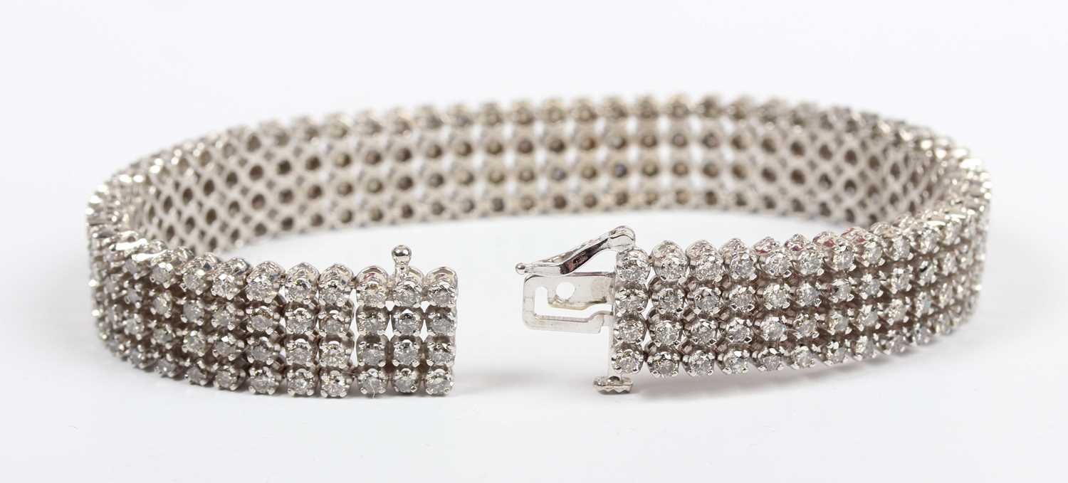 A white gold and diamond bracelet, mounted with four rows of circular cut diamonds, on a snap clasp, - Image 2 of 3