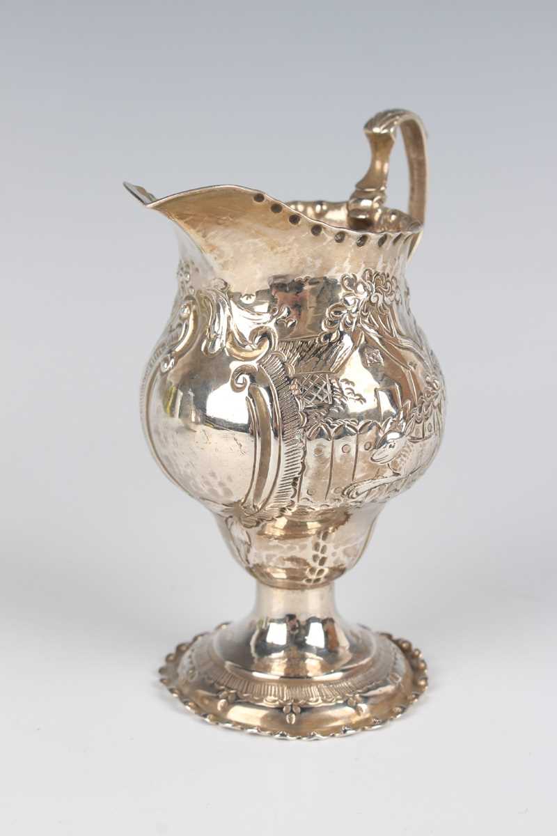 A George III silver oval cream jug, engraved with festoon tassel decoration, London 1801, height 9. - Image 4 of 6