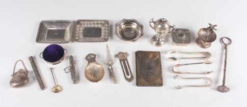 A small group of silver, including a tea caddy spoon with scallop shell bowl and pierced handle,