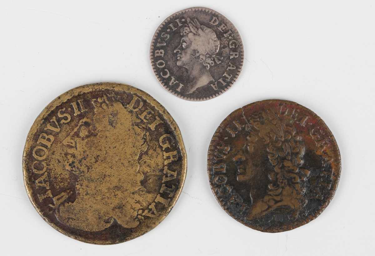 A James II silver fourpence 1687, a James II gun money shilling December 1689 and a James II gun