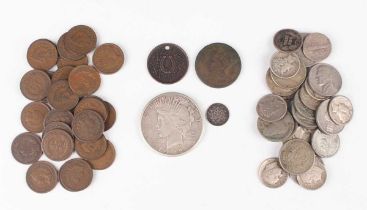 A collection of USA coinage, including a Peace dollar 1922, a silver three cents 1862, a group of